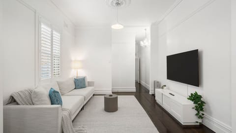 A stunning open-plan living area featuring sleek floors and a contemporary design with quality appointments throughout