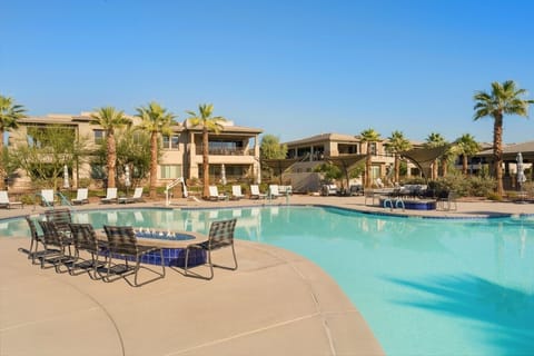 Resort style communal pool with lounging area
