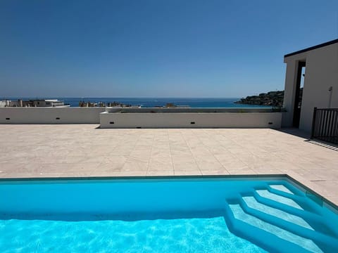 Our brand-new rooftop pool awaits — perched high above the city, this private re