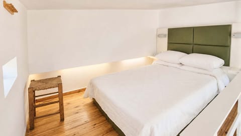 A comfy double bed awaits for moments of relaxation
