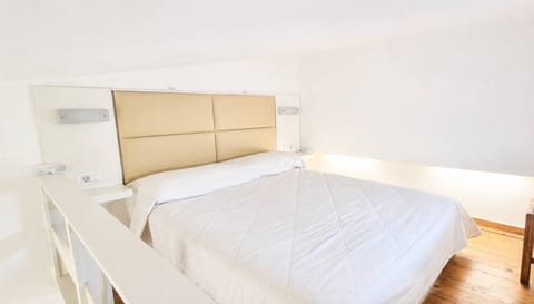 A comfy double bed awaits for moments of relaxation