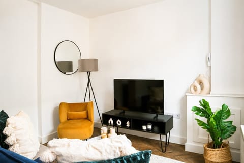 There is a flat screen TV with local channels and free Wi-FI