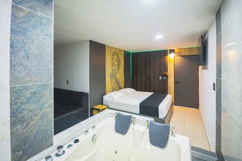 Deluxe Suite, Balcony, City View | Minibar, WiFi (free), bed sheets