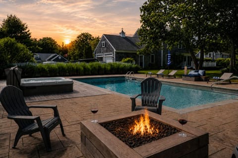 Gather around the gas fire pit as the sky glows over your heated pool