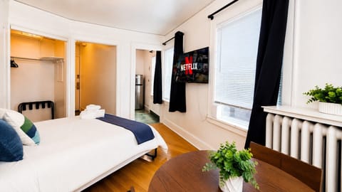 Smart TV with Netflix, Amazon Prime Video, YouTube, and other popular streaming apps—perfect for relaxing and enjoying your favorite movies and shows after a day in the city.