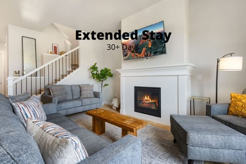 Sink into plush sofas while the fireplace crackles and mountain vistas adorn the walls—your cozy retreat awaits after a day of adventure.