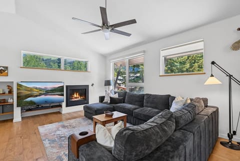 Spacious living room with fireplace and smart tv
