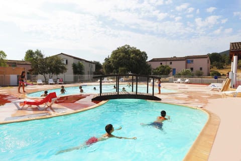 Guests enjoy a refreshing dip in the outdoor pool — the ideal way to unwind after a day exploring the medieval village of Sauve or the Cevennes gorges.