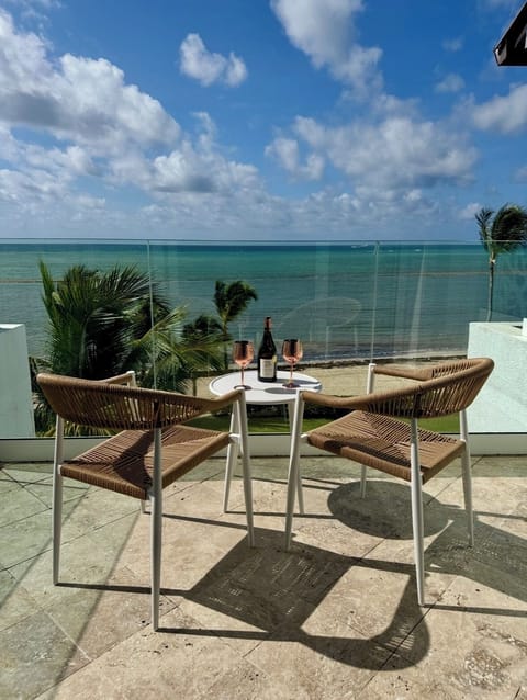 Oceanfront  Deck with Caribbean Sea views and outdoor table 