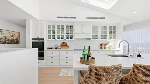 The ultimate island bench for wine nights and slow morning starts.