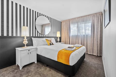 Relax in style with plenty of space in this large queen room.