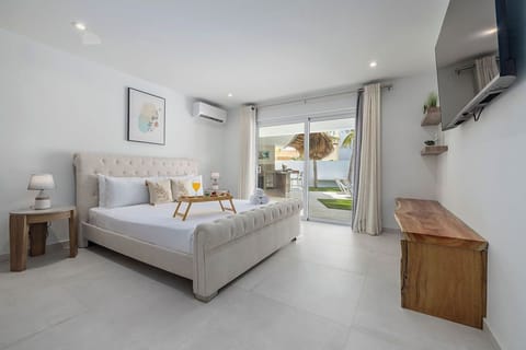 This bedroom is the ultimate relaxation haven, designed to give you the peaceful, luxurious sleep you deserve on vacation. Crisp, bright, and beautifully appointed, it perfectly blends modern elegance with warm, natural island accents.