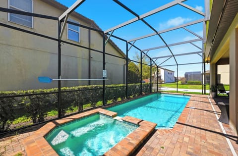 Poolside Retreat: Dive into relaxation in this private screened pool oasis, perfect for sunny days!