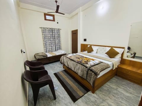 Deluxe Triple Room, City View | Desk, laptop workspace, soundproofing, iron/ironing board