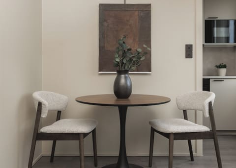 Chic dining nook with modern decor and cozy seating for two