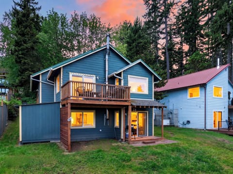 Lower-level apartment with a private entrance, warm evening glow, and peaceful Whidbey Island surroundings.