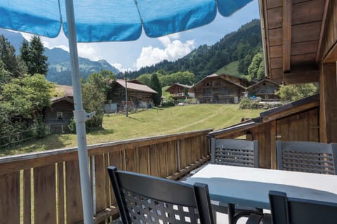 Private balcony with outdoor seating and sun shades
