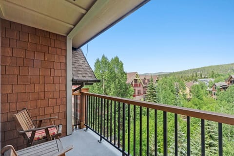 Property nestled in a scenic mountain valley surrounded by dense forest and neighboring vacation homes.