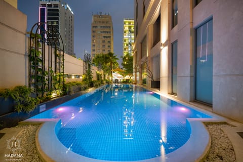 Outdoor pool, open 6:00 AM to 10:00 PM, pool umbrellas, sun loungers