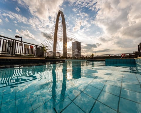 Outdoor pool, open 6 AM to 10 PM, pool umbrellas, sun loungers