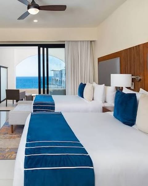 Spacious second bedroom with two queen beds—perfect for family or friends.