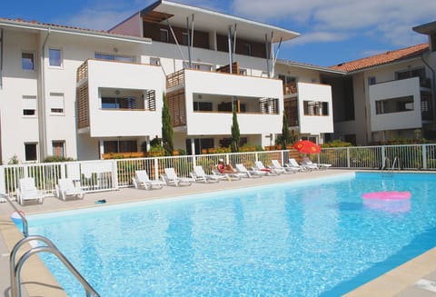 The outdoor pool is the heart of summer stays, surrounded by sun loungers and open skies.