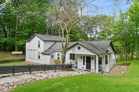 Charming woodland cottage with a covered porch and peaceful, private setting