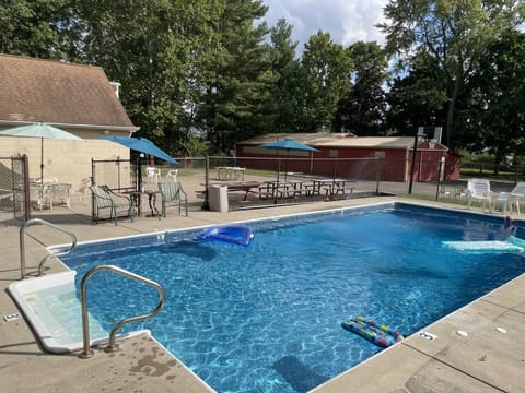 18x36 pool adjacent to picnic and BBQ area. 3 feet at shallow end, 8 feet at deep end. Clear view of other exterior activities. Easy access to guest bathroom without entering the main house. Life safety equipment hangs on the fence. Lockable fence.
