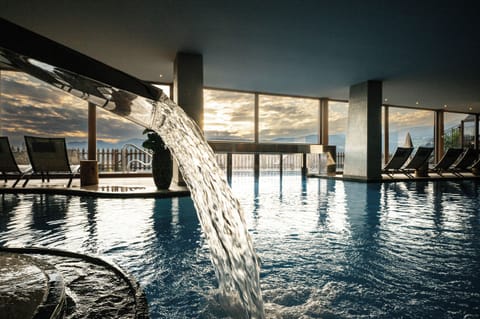 Indoor pool, outdoor pool, pool umbrellas, sun loungers