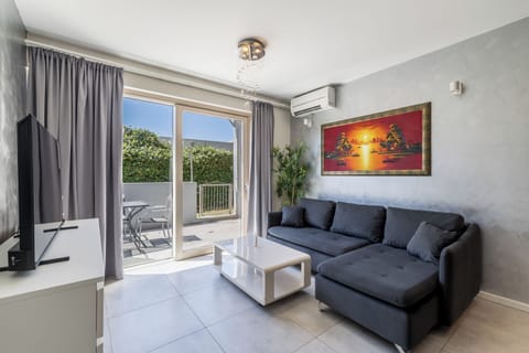 Classic Apartment, Patio, Garden View | Living area | Flat-screen TV