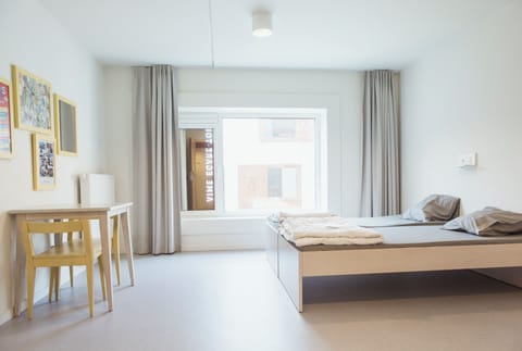 Comfort Twin Room, 2 Twin Beds, Shared Bathroom | Down comforters, in-room safe, blackout drapes, soundproofing