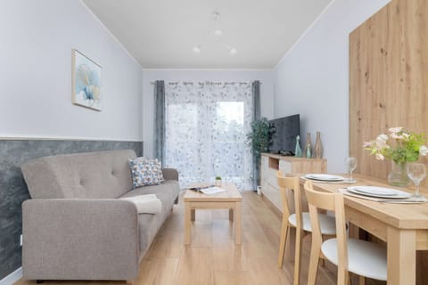 Relax in the stylish living room with a comfortable sofa and modern decor.