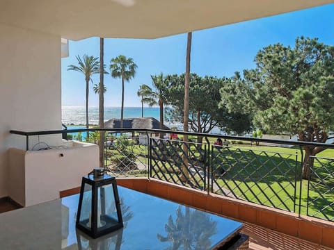 Sea, pool and garden view from spacious terrace.