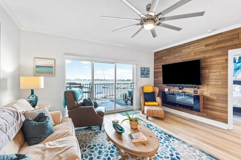 Living room with large flat-screen TV and fireplace