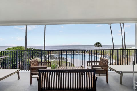 Unwind with your morning coffee or evening drink in your private oceanfront seating area, where the soothing sounds of waves and refreshing sea breeze create the perfect escape.