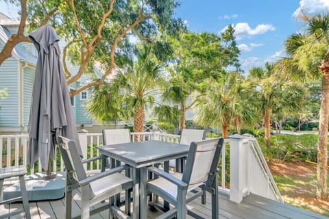 Unwind on your private balcony with lush garden views and cozy outdoor seating—perfect for morning coffee or evening relaxation under swaying palms.