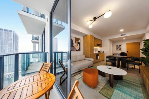 Condo, Balcony, City View | Living area | 36-inch Smart TV with cable channels