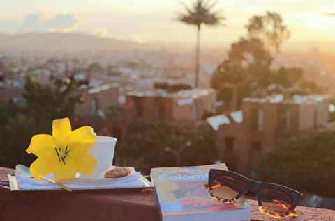 Coffee with panoramic sunset views over Historic Bogotá from our rooftop.