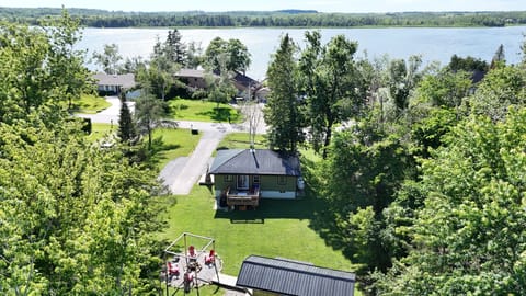 Peaceful lake-area cottage with spacious yard and scenic water views