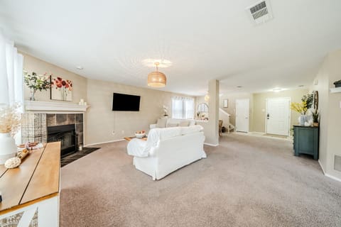 Cozy up by the fire or enjoy a movie night in this spacious lounge.
