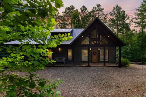 Luna Ridge welcomes you with a warm cabin glow and wooded privacy.