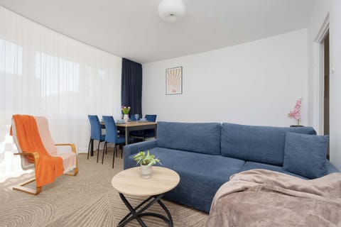 Relax in the stylish living room with a comfortable sofa.
