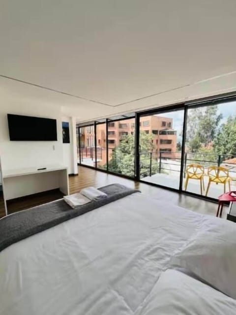 Deluxe Suite, Balcony, City View | Hypo-allergenic bedding available, WiFi (free), bed sheets