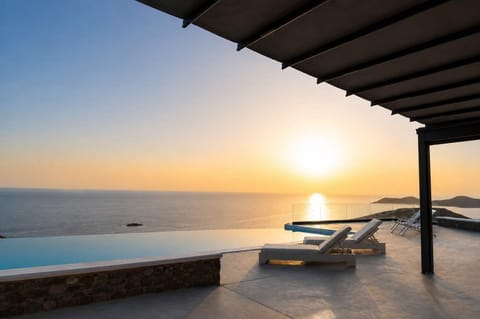 Golden-hour luxury with a private pool overlooking the Aegean Sea.