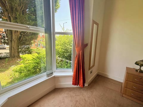 Bright bedroom with garden views