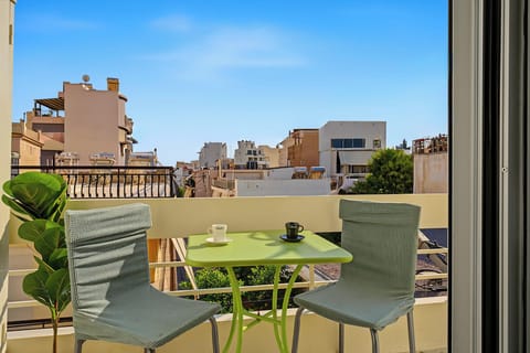 Balcony dining above Athens rooftops