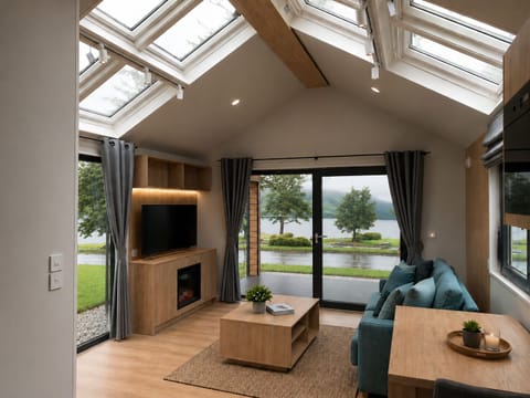 Cabin, 1 King Bed with Sofa bed, Balcony, Lake View | Living area | 40-inch LCD TV with digital channels, fireplace, Netflix