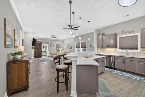 Gather together in this bright, open-concept kitchen and living area designed for entertaining.