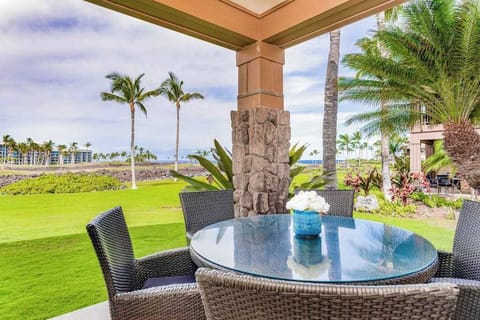 Covered Patio Dining Area with Scenic Lawn and Ocean Views