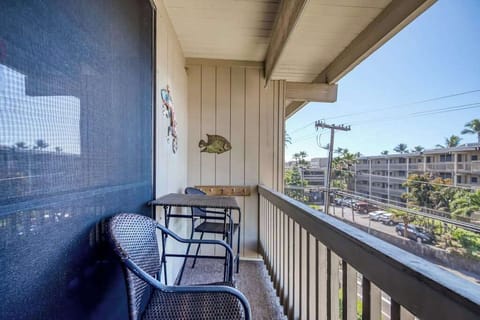 Private balcony space featuring a sturdy safety railing, cozy outdoor chairs, a small table, and open views of the resort complex grounds! 🪑☀️🌴✨